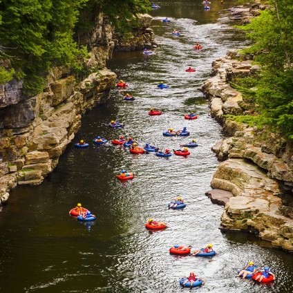 Many people tubing down the river